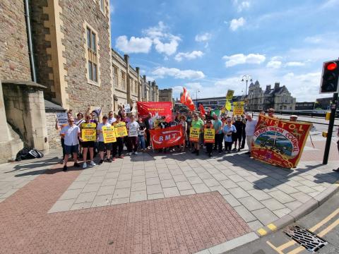 RMT picket line in Bristol this morning, dozens of people with trade union banners and RMT banners and placards line the pavement on the approach to Temple Meads train station