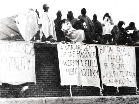 prisoners with banners 
