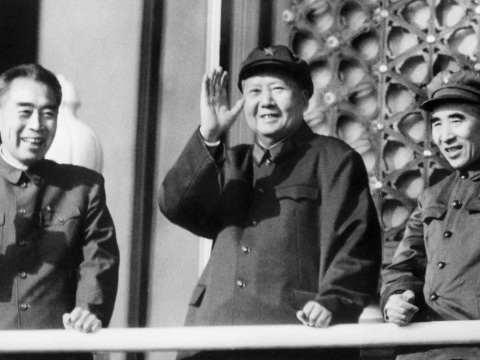 Premier Zhou Enlai, left, and the defense minister, Lin Biao, right, with Chairman Mao Zedong, waving copies of the “Little Red Book” of Mao’s sayings as they reviewed troops in Beijing in October 1967