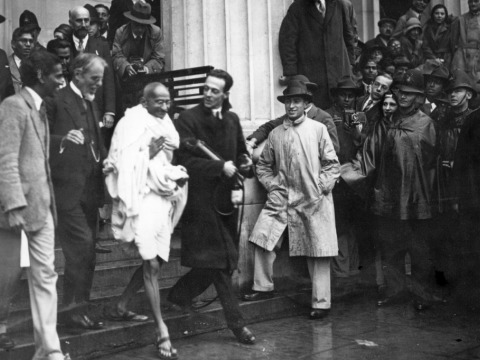 Gandhi leaves a meeting in London in 1931. (Douglas Miller / Getty)
