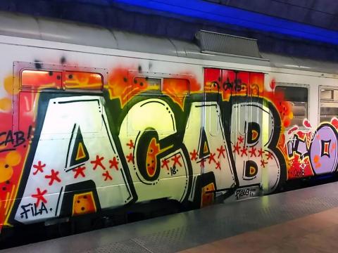 ACAB graff on a metro train