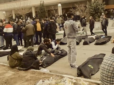 blood-soaked bodies said to have been piled in public thoroughfares