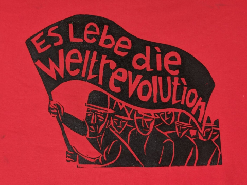 Long Live The World Revolution - human figures holding up a flag