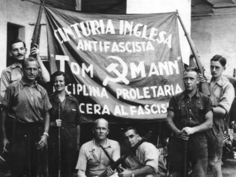 A photograph of the "Tom Mann Centuria" group of English communists who fought in the Spanish Civil War with banner including hammer and sickle