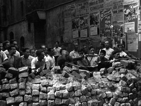 Barricades and armed civilians in the streets of Barcelona during the Spanish Revolution, July 1936.