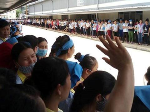 Various striking workers gather around a central courtyard.