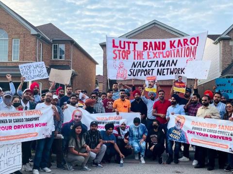 Naujawan Support Network action against wage theft. Rally against wage theft. Dozens of people with banners outside workplace.