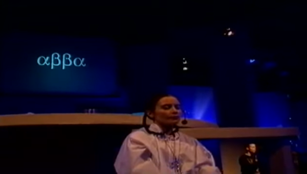 A robed woman participates in a ceremony of the Nine O'Clock Service cult