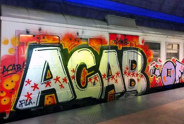 ACAB graff on a metro train
