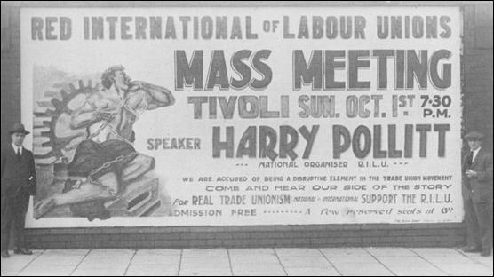 Harry Pollitt standing by a poster advertising a Harry Pollitt rally