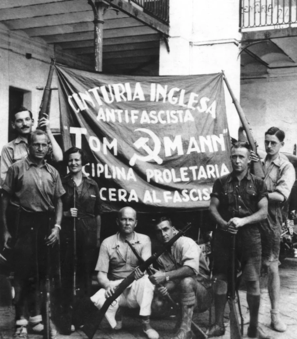 A photograph of the "Tom Mann Centuria" group of English communists who fought in the Spanish Civil War with banner including hammer and sickle