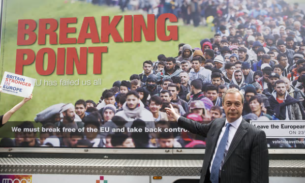 Nigel Farage in front of a Leave campaign poster