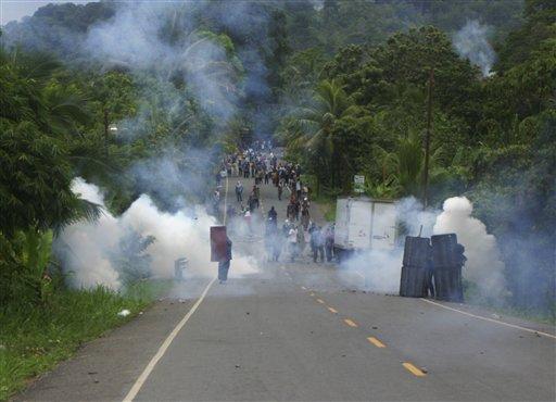 Banana workers strike, receive tear gas. Two killed in "shot-gun" clash. (AP Photo) Banana workers strike, receive tear gas. Two killed in "shot-gun" clash.