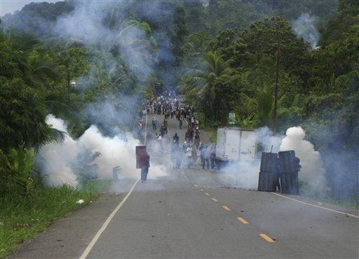 Banana workers strike, receive tear gas.  Two killed in "shot-gun" clash.